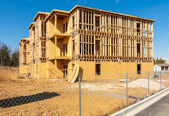 a close-up of temporary chain link fences enclosing a job site, signaling progress in the project's development in Belvedere CA